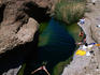 Man swimming in the Hata Rock Pools, Hajar Mountains.