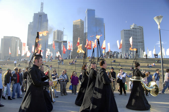 Orchestra Ulik and Le Snob in 'Glisssssendo' as they glide along river bank, Melbourne city festival at Birrarung Marr.