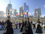 Orchestra Ulik and Le Snob in 'Glisssssendo' as they glide along river bank, Melbourne city festival at Birrarung Marr.
