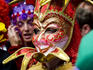 Person in Venetian mask, New Orleans Mardi Gras.