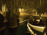 Classical musicians performing in rowboat in Cuevas del Drach Cave (Cavern of the Dragon).