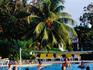 Group playing volleyball in swimming pool, Hotel Breezes.