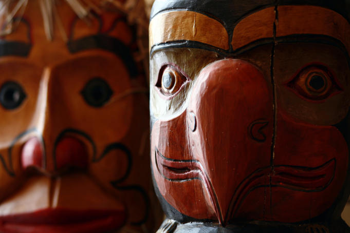 Native American wood carvings on display.