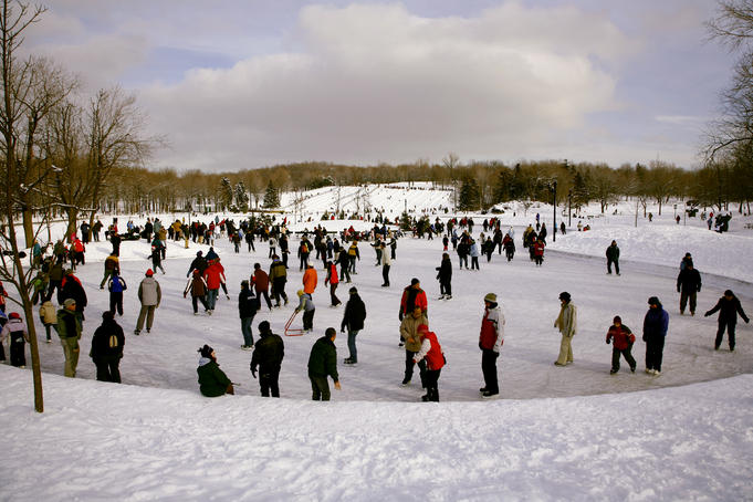 People ice-skating on Beaver Lake (Lac aux Castors), Parc du Mont Royal.