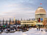 Domed building with Canadian flag flying, Parc du Bassin Bonsecours, with Sailor's Memorial Clocktower in background.