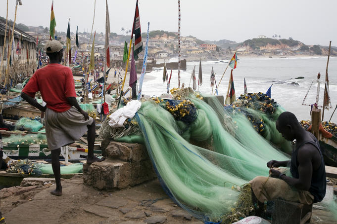 fishermen mending nets