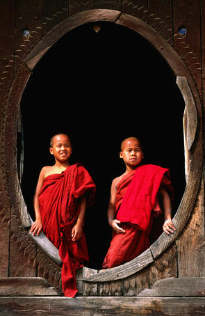 Young monks in window, Shwe Yaunghwe Kyaung temple.