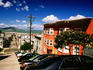 Steep street on Russian Hill with Alcatraz in background.