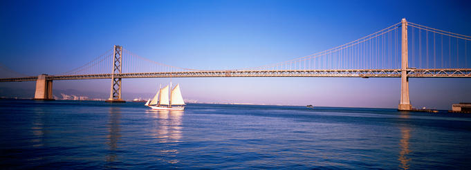Sail boat under the Bay bridge.