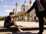 Person playing chess out the front of Karlskirche Cathedral.