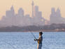Fishing off rocks at Silver Beach, Botany Bay.