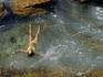 Woman floating in rock pool.