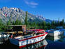 Boats in dappled shade, moored at the jetty on Jenny Lake - Grand Teton National Park, Wyoming
