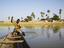 Paddling away from Bozo fishing, Mali