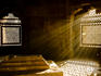 Shafts of early morning sunlight shining through lattice window into tomb of Isa Khan near Humayin's tomb in New Delhi.