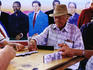 Men playing dominoes Maximo Gomez Park in Little Havana.