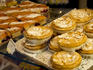 Cakes on display in patisserie.