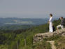 People over look the green hills from the old ruins on top of Mount Schauenberg, Schlatt.