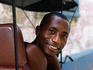 Smiling pedicab driver.