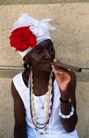 Cuban woman smoking cigar, Plaza de Armas.