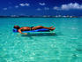 Tourist floating on airbed, White Beach.