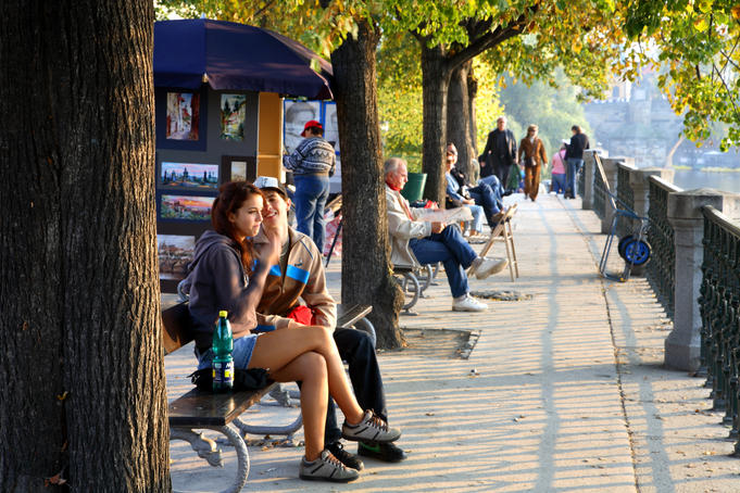Autumn colours and people along Vltava Moldau River.