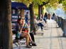 Autumn colours and people along Vltava Moldau River.