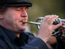 Busker plays the trumpet.