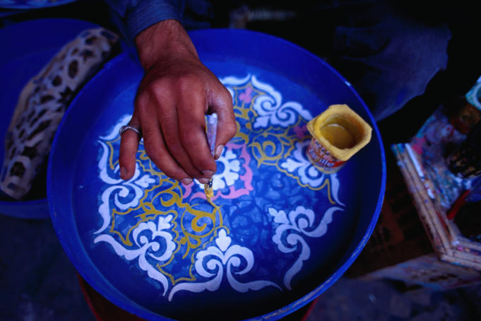 Hand painting ceramics in the Potters Souq of the medina, Marrakesh