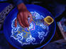 Hand painting ceramics in the Potters Souq of the medina, Marrakesh