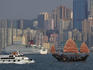 Sightseeing junk on Victoria Harbour with Causeway Bay high-rise in background.