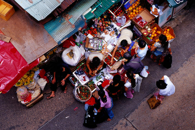 People at fruit stall on Cage Street.