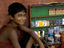 Cigarette stall proprietor in Sudder Street.
