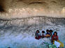 Children and pictographs in Painted Cave, Cusarare.