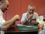 Old men playing traditional card game in bar next to Fuente de Santa Cecilia, Pamplona