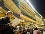 Studying the horses in front of main stands at Happy Valley Racecourse.