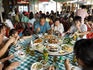 Family sharing meal at waterfront restaurant, Cheung Chau village.