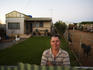 Local man outside house.