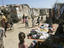 Clothes, fruit and vegetables for sale in a Bosaso slum.
