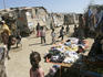 Clothes, fruit and vegetables for sale in a Bosaso slum.