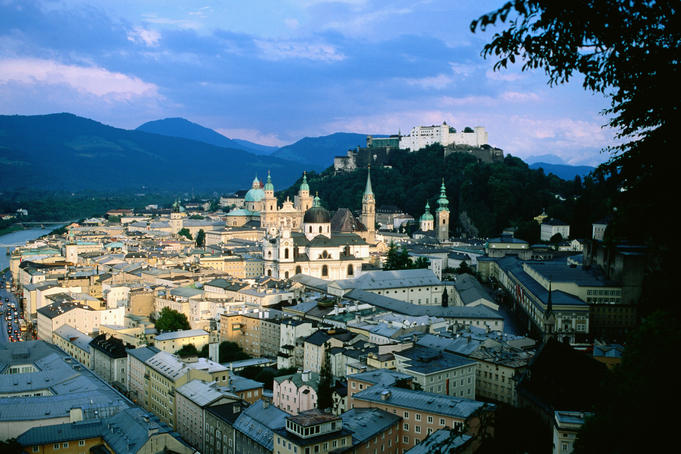 City with fortress and castle at dusk .
