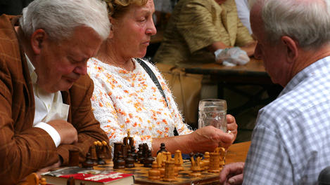 Men playing game of chess.