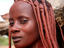 Woman displaying typical Himba hairdressing.