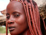 Woman displaying typical Himba hairdressing.
