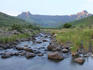 Sunrise over stream with Table Mountain in background.