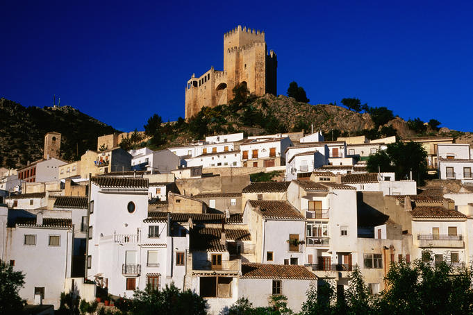 Castillo de los Fajardo towering above whitewashed village houses, Velez Blanco.