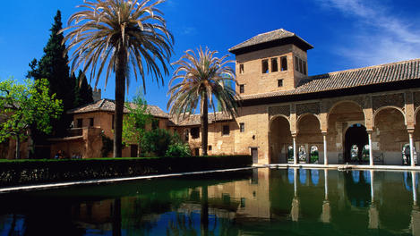 Palacio del Partel reflected in a pool, Alhambra.