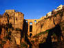 Puente Nuevo in the evening light with a parador (luxury hotel) on the clifftop (left), Ronda
