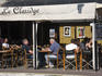 People dinning in an outdoor restaurant, Place De Gaulle.