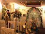 Elvis impersonator showing interior of wedding chapel.